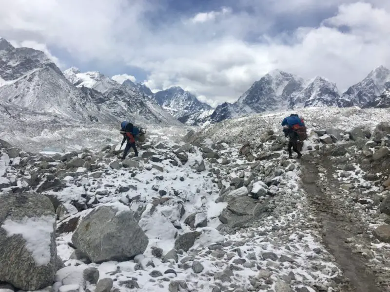 Everest Base Camp remoteness - Porters carrying goods.