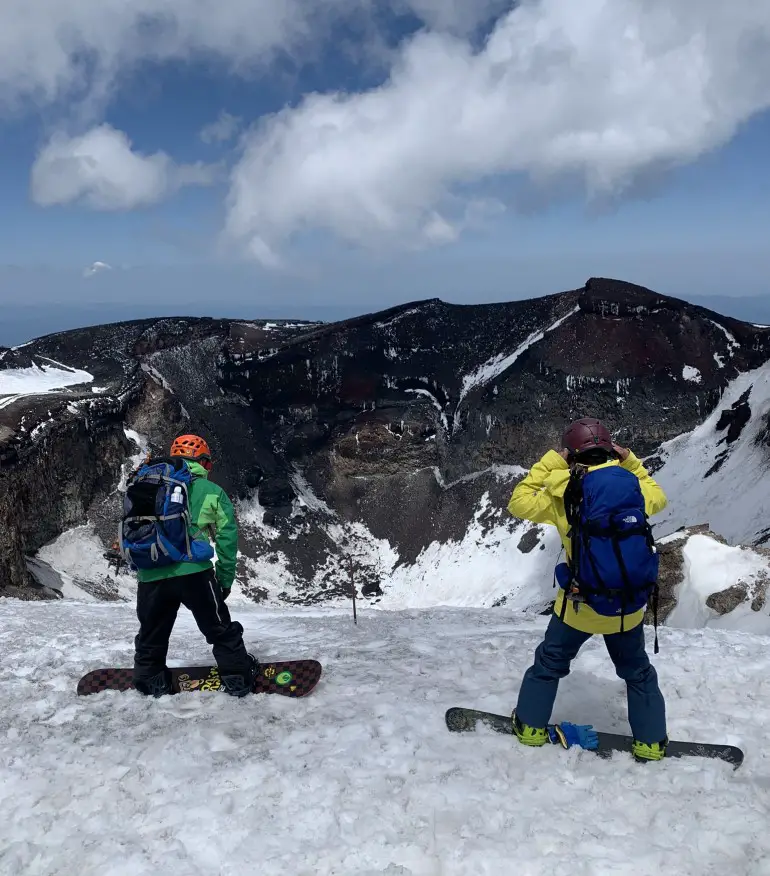 Mount Fuji snow climb without crowds - snowboarders on top of Mount Fuji